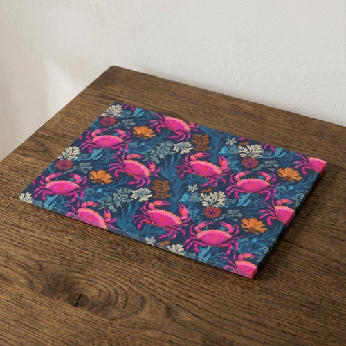 Placemat with pink crab pattern on a wooden surface