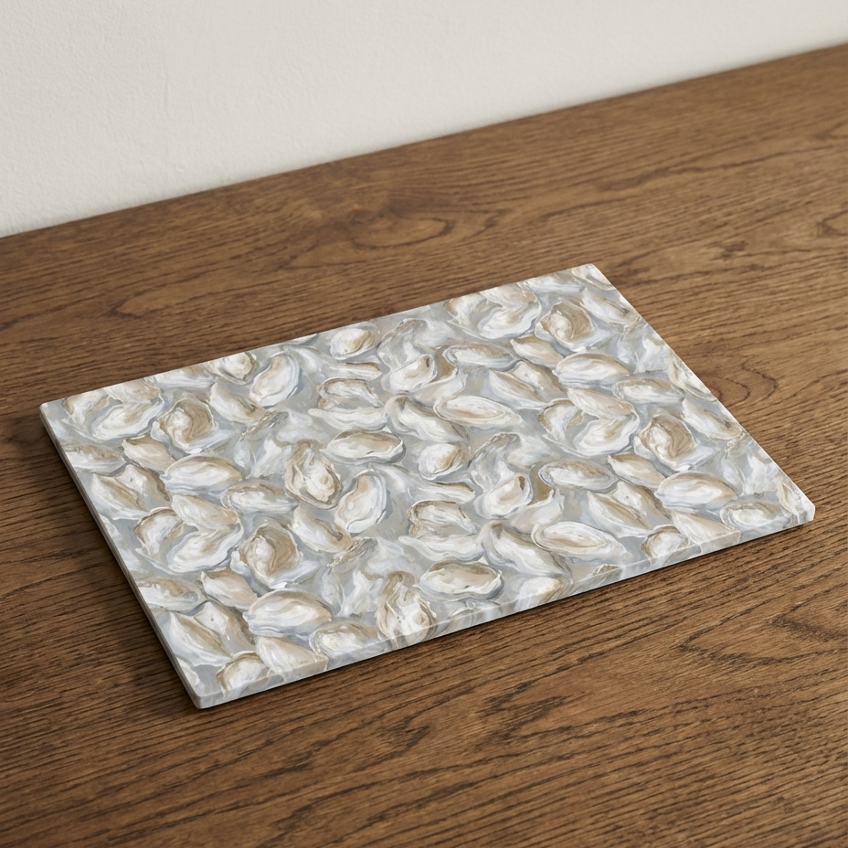 Rectangular oyster shell-patterned mat on a wooden surface
